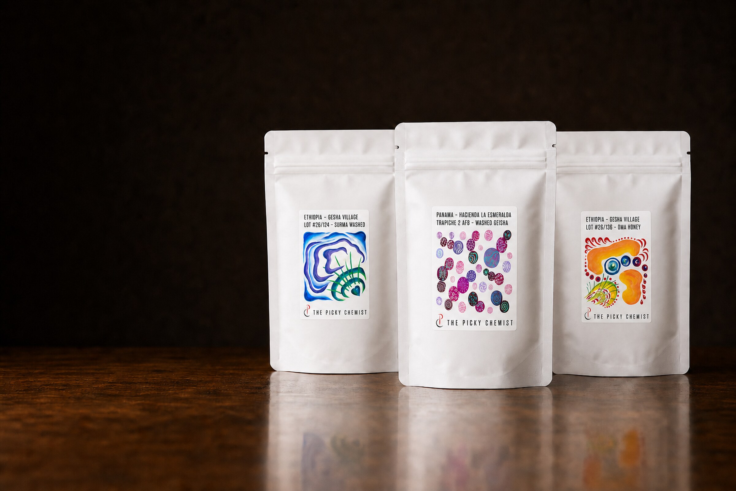 AI-generated mockup of three TPC coffee bags using official coffee artwork